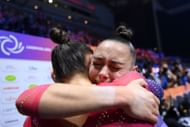 Jessica Gadirova celebrates with twin sister Jennifer Gadirova after winning a gold medal in the Women's Floor Final at the FIG Artistic Gymnastics World Championships in 2022